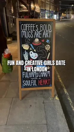 Group enjoying pottery painting and drinks at Pottery Cafe, a creative and cozy spot in Fulham, London.