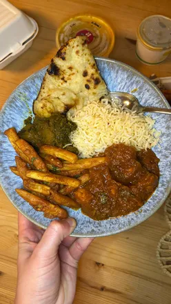 Giveaway prize featuring a curry, rice, and onion bhaji from The Maharaja in Manchester. Follow to enter!