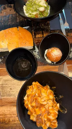 Delicious Italian street food at Pasticcio Glasgow, featuring beef ragu and arancini on a Friday night visit.