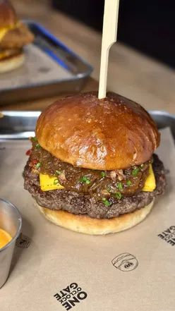 Delicious Asian-inspired burgers and unique sides at One O’clock Gate in Dinas Powys, showcasing vibrant flavors.