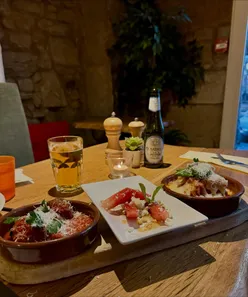 Family enjoying dinner at Café Antipasti in Glasgow, featuring Italian vegetarian dishes and kid-friendly mac and cheese.