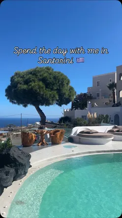 Exploring Santorini's white-washed streets, capturing the charm of Greece with a touch of Northern Irish magic.