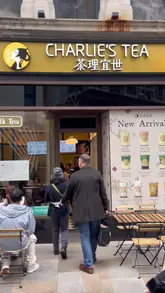 Enjoying Ceylon Black Tea and Brown Sugar Matcha Latte at Charlie's Tea, a popular bubble tea spot in London.