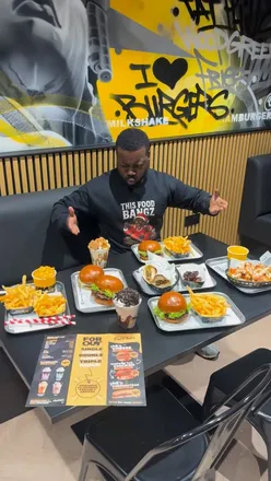 Delicious Fat Phill's burgers and cheesesteaks at their new Wood Green location, featuring signature Phill’s sauce.