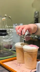 Cozy tea spot Run Tea in Chinatown, showcasing Oolong and Black Rose lattes with fresh, natural ingredients.