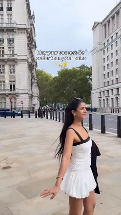 Inspirational quote on a peaceful backdrop, highlighting positivity and personal growth in a bustling London setting.