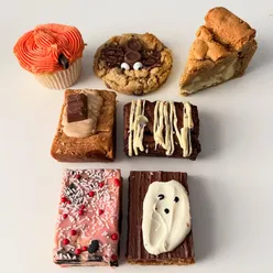 Honesty Cake Shed in Leicester showcasing delicious homemade Halloween treats like cupcakes and brownies.