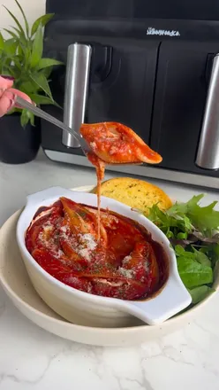 Air Fryer Pepperoni Stuffed Pasta Shells with ricotta, mozzarella, and pepperoni in tomato passata, served with garlic bread.