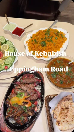 Delicious mixed grill and curry dishes served at House of Kebabish in Leicester, featuring an open charcoal grill.