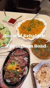 Delicious mixed grill and curry dishes served at House of Kebabish in Leicester, featuring an open charcoal grill.