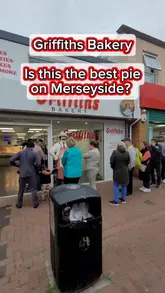 Griffith’s Bakery in New Ferry, Wirral, serving fresh pies, with long queues of eager customers.