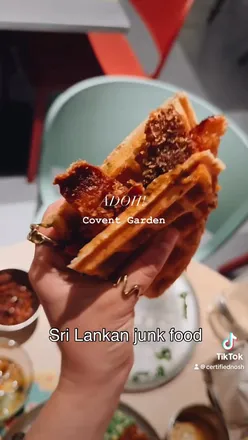 Delicious Sri Lankan street food spread at ADOH in Covent Garden featuring mutton roll, prawn toast, and more.