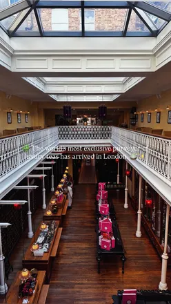 Afternoon tea at Mariage Frères in Covent Garden, featuring tea-infused pastries and elegant decor in a Parisian setting.