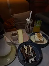Indulged in desserts at Murk Lounge, London, with a cozy vibe and sweet treats galore. 🍰✨