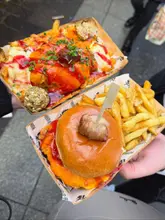 Delicious festive parmo fries and parmo in a bun at Newcastle Christmas markets with @parmorama.