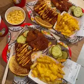 Delicious crispy spicy chicken tenders with cheesy crinkle fries from Dave's Hot Chicken in Stevenage, Hertfordshire.