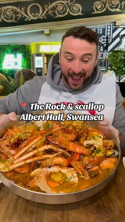 Delicious seafood boil featuring lobster, king prawns, scallops, and more at The Rock and Scallop in Swansea.