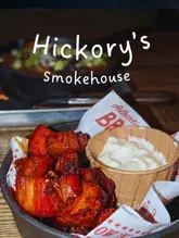“Delicious Texan-style barbecue platter at Hickory's Smokehouse in Thornaby, featuring smoked meats and sides.”