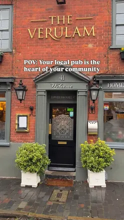 Guests enjoying a warm atmosphere at The Verulam pub in St Albans with friendly service and festive vibes.