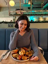 Vegan buffet Sunday carvery at Unity Diner featuring festive dishes like cauliflower cheese and roast potatoes.