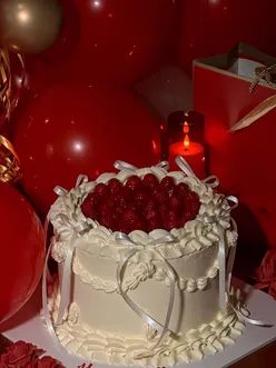 Birthday cake from Krema Bakehouse in Edinburgh, featuring fresh cream, raspberries, and pistachio filling.