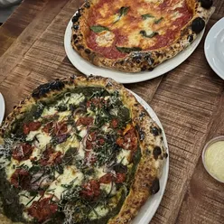 Delicious pizza varieties including margarita and spicy pepperoni at Cornwall Rec in Penryn, with onsite brewed beers.