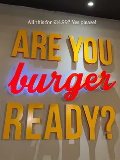 Delicious Peri Peri Burger with fries, ice cooler, and loaded churros at Amigos Burgers & Shakes in Southall.