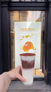 Enjoying the new Tiramisu Rich Chocolate drink in London—a festive treat from HEYTEA, POP MART, and TWINKLE TWINKLE collaboration.