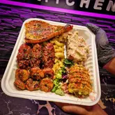 Delicious American-style soul food from Bubba's Trap Kitchen in Birkenhead, featuring BBQ chicken and lobster tail.
