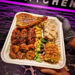 Delicious American-style soul food from Bubba's Trap Kitchen in Birkenhead, featuring BBQ chicken and lobster tail.