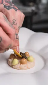 A compilation reel showcasing a year of professional food and hospitality photography, featuring a wide variety of dishes, drinks, and venue interiors.
