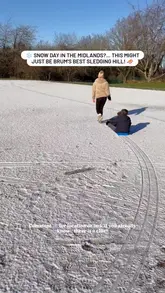 A short, casual video featuring a family sledging on a snowy hill in Birmingham. The video uses a mix of handheld and tracking shots to document the activity, accompanied by a voiceover and text overlay.