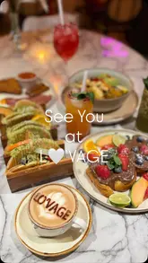 A short, aesthetic montage showcasing a variety of brunch and lunch items at Lovage. The video features close-ups of cocktails, smoothies, coffee, and various plated dishes like French toast and a full English breakfast, set to music with simple text overlays.