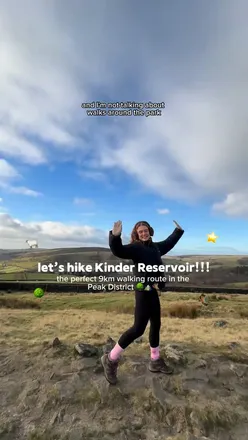 Hiker enjoying a scenic walk around Kinder Reservoir in Peak District, surrounded by nature and stunning views.