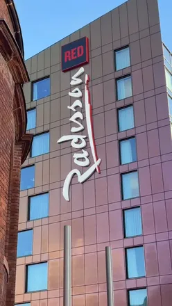 Enjoying cocktails and small plates with stunning city views at Radisson RED Sky Bar, Glasgow. Perfect for social catch-ups!