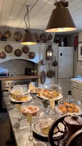 A montage video showcasing the interior, decor, and cake selection of Townhouse in Spitalfields, London. The video highlights the antique shop, art gallery, and cozy basement cafe atmosphere.