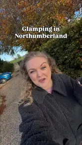 A detailed, first-person vlog tour of a glamping hut in Northumberland called The Whistle Stop at Chollerton. The creator walks the viewer through the exterior, the outdoor bath, the interior living space, kitchen, and bathroom, providing a thorough look at the amenities and the cozy atmosphere.