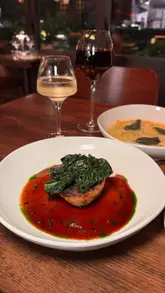 A montage video showcasing the interior, food, and drinks at a restaurant called Templar in Stratford, London. The video features close-up shots of various dishes like smoked duck breast, truffle ravioli, and pigs head croquette, alongside cocktails and wine, with text overlays indicating prices.