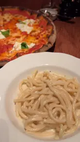 The video follows a couple using the EatClub app to find and book a discounted date night at Nipotina restaurant in London. It intercuts screen recordings of the app's search and payment process with footage of the couple arriving at the venue and enjoying their meal.