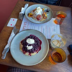 Brunch spread featuring dishes from various cafes and eateries in London, highlighting breakfast favorites.