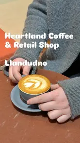 Interior of Heartland Coffee & Retail Shop in Llandudno, showcasing modern design and coffee equipment.