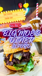 A promotional video for Big Moe's Diner featuring a montage of the 50s-themed interior and a variety of indulgent American diner food, including milkshakes, burgers, brisket, and loaded fries, accompanied by a voiceover review.