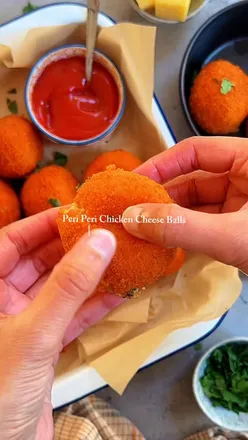 ✨Ramadan Recipes✨ Peri Peri Chicken Cheese Balls

Cheese Balls MUST be one of the most popular Ramadan, iffar savoury food recipes. There are many variations to making Cheese Balls and I’ve tried many (some you can find on my IG - if you were looking to check them out 🙏). This year I decided to try a twist on the OG version and be more bold and fiery in my flavours 🤩. 

Welcome to my version of Peri Peri Chicken Cheese Balls 😍. The Cheese Balls can be made in advance and frozen, deep fried or baked in the air fryer - whatever you fancy to make our fasting days, in Ramadan, that little more easier. Get your ingredients from @mullacosupermarket and look out for the Ramadan Sale coming soon!!

SAVE and SHARE the recipe and let me know how you get along - you can thank me later ☺️.

Ingredients - makes approx 30/40 Cheese Balls (depending on size)

For the Chicken Mixture:
500g Shredded Chicken (you can use mince or small cubed) 
2tbsp Peri Peri Seasoning
1tsp Onion Powder
1tsp Red Chilli Powder
1tsp Coriander Powder
1tsp Cumin Powder
Salt and Black Pepper - to taste
2 small smashed potatoes
1 cup boiled macaroni/pasta
2 boiled eggs - grated
2 cups cheese - mix of mozzarella and cheddar 
Chopped fresh coriander 
1 cup white sauce for binding - heat 1 cup milk. Add 1tbsp cornflour mixed with water. Stir continuously until thick and to avoid lumps.

For Filling & Coating:
Cheese - Mozzarella or cheddar cubes
Egg - beaten, mix with flour and a little milk to make a slurry
Breadcrumbs @supremeingredients 
Oil - for deep frying 

Method
1. Prepare the Mixture - in a bowl combine the chicken, smashed potatoes, pasta, egg and seasoning. Mix well until thoroughly combined. Add the coriander and white sauce.
2. Form the Balls - take a small portion of the mixture and flatten it in your palm. Place a cube of cheese in the center and fold the chicken mixture around it. Chill for approx 1 hour.
3. Coat the Balls - dip into the beaten egg and coat with breadcrumbs - can be frozen at this stage.
4. Fry the cheese balls until golden brown and cooked through.

#cheeseballs #chickenballs #ramadanrecipes #cheesepull #ramadan