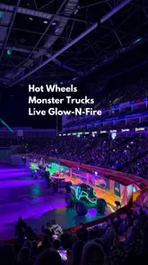 A compilation of clips from the Hot Wheels Monster Trucks Live Glow-N-Fire show at The O2, featuring monster trucks performing stunts, light shows, and crowd reactions.