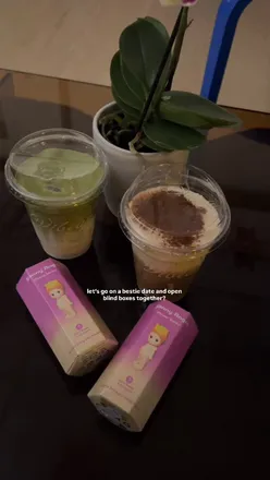 Friends enjoying Sonny Angel figurines at Vibe Cafe in Manchester, celebrating life's moments together.