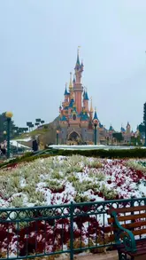 Disneyland Paris beautifully blanketed in snow, showcasing the magical castle in January 2026.