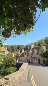A travel vlog documenting a day trip from London to three picturesque locations: Lacock, Castle Combe, and Bradford-on-Avon. The video features the creator visiting historic sites, walking through scenic villages, and enjoying a Sunday roast at a pub.