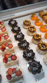 A montage of various Japanese-inspired pastries, cakes, and drinks from Onsu Bakery, showcasing the texture and presentation of the items through high-quality close-up shots.