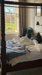 A short, engaging video tour of a boutique aparthotel suite in Leith, Edinburgh. The video follows the creator as they enter the room, highlighting the four-poster bed, the view, the bathroom, and the kitchen facilities, creating a welcoming and aspirational atmosphere.