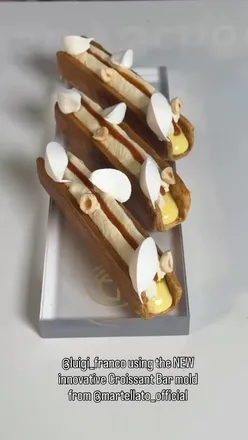 Behind the scenes with chef @luigi__franco creating stunning pastries using the NEW La Sfoglia Bar.

A classic concept reimagined with a modern twist ✨

The new bar moulds by @martellato_official give chefs the freedom to create something truly special — delivering fresh, contemporary fillings in every bite and a more universal, modern pastry experience.

All made possible by the innovative Croissant Bar mould from @martellato_official, available in the UK via @homechocolatefactory.

For the full video + recipe, click the link in @luigi__franco’s bio.

Reel by @luigi__franco no copyright infringement intended. 

#pastryinspiration #lamination #pastry #pastrychef